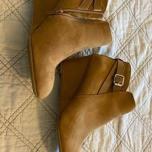 Tan wedge booties with buckle embellishments